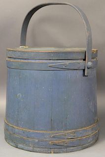 Primitive blue painted firkin with swing bentwood handle and three straps. ht. 14 1/4in., dia. 14 1/4in.  Provenance:  Estate