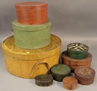 Group of nine bentwood boxes to include large yellow painted cheese box with two bentwood handles signed R. Hyde, a large ova