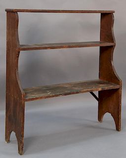 Pine bucket bench having three shelves on boot jack ends, 19th century, possibly Pennsylvania.  ht. 46 3/4in., wd. 41 1/2in.,