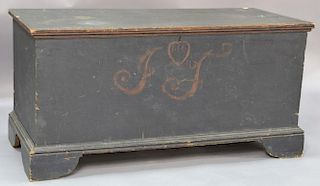 Primitive lift top blanket chest in original dark green paint on bracket base, decorated with red heart and letters.  ht. 21 
