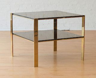 LARGE BRASS AND SMOKED GLASS END TABLE, IN THE STYLE OF MICHAEL TAYLOR