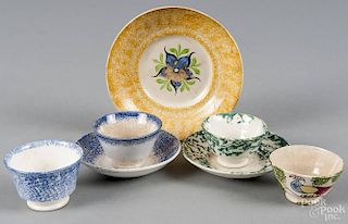 Four pieces of spatterware, 19th c., to include a yellow morning glory saucer, two blue handleless c