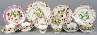 Sixteen pieces of Staffordshire porcelain, 19th c., in a strawberry pattern, largest plate - 9 3/4''