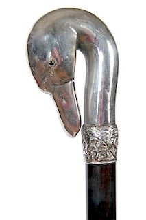 12. Sterling Swan Dress Cane- 20th Century- An unsigned sterling swan but tested with a pair of glass eyes, ornate signed ste