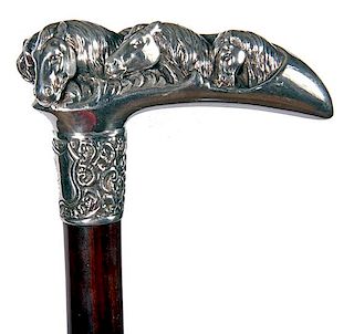 16. Silver Horse Cane- 20th Century- A high relief sterling handle with six horses, ornate signed sterling collar, exotic woo