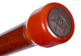 41. Masonic Bakelite Cane- Ca. 1930- A Bakelite handle with a Masonic emblem crest atop, exotic wood shaft and a horn ferrule