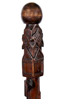 40. Masonic Folk Art Cane- Ca. 1900- A one-piece carved folk cane with four Masonic emblems, snakes, rifles with bayonets, sp