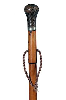 58. Knockerbie Cane- Ca. 1880- A nice example of a defensive cane with a leaded handle which has been woven in fine leather, 