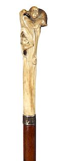 61. Japanese Stag Monkey Cane- Ca. 1890- A carved stag handle with two monkeys atop, signed sterling collar, exotic wood shaf