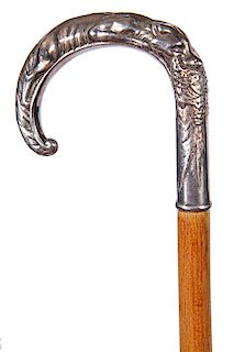 73. Knockerbie Defensive Cane- Ca. 1920- A heavy cast handle with a dog which has a pheasant in his mouth, the handle is sign