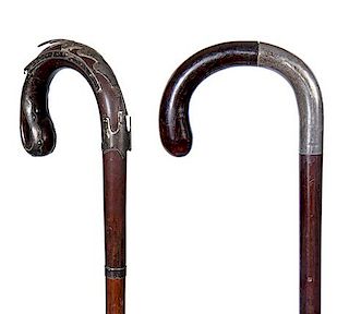 75. A Pair of Silver Crook Canes- One is fine, the other has some damage. A.L.- 36” $150-200