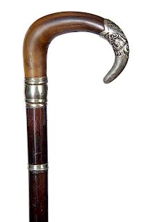 79. Victorian Horn Dress Cane- Ca. 1870- A nice curved horn with a silver metal endcap, engraved silver metal collar and spac