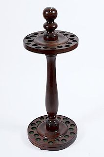 99. Walnut Cane Stand- 20th Century- This stand will hold 20 canes and will come apart for shipping. W.- 11” H.- 28” $300