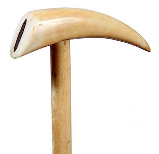 98. Nautical Tooth Cane- Ca. 1860- A nicely formed tooth with a wood inlay in the cavity, whale bone shaft and never had a fe