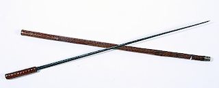 104. Sword Cane- Ca. 1880- A hardwood handle with a 26” blade which has a push-and-pull mechanism, exotic wood shaft and a 