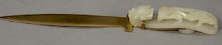 Jade belt buckle mounted as a letter opener handle having relief carved jade dragon. 
buckle lg. 3 1/2in., total lg. 6in.