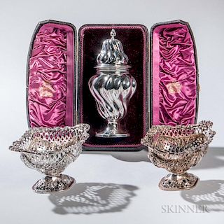 Three Pieces of English Sterling Silver Tableware, each London, a Victorian caster, 1891-92 by William Comyns in a fitted cas