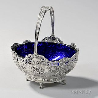 Two Pieces of German .800 Silver Tableware, early 20th century, a reticulated oval basket, lg. 12 3/4, and a basket with coba