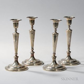 Four Tiffany & Co. Sterling Silver Candlesticks, New York, 1907-38, monogrammed, each with an urn-form sconce with reeded bob