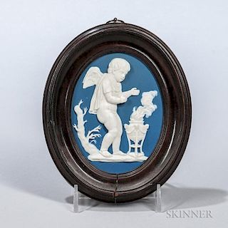 Wedgwood & Bentley Jasper Plaque of Winter, England, c. 1775, oval solid blue body with a darker blue wash and applied white 