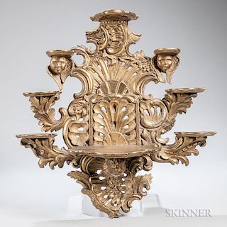 Rococo-style Giltwood Wall Bracket, heavily carved overall, two centralized shelves flanked by six smaller shelves, accented 
