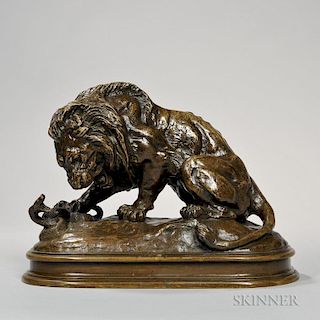 After Antoine-Louis Barye (French, 1795-1875)  Bronze Figure of a Lion and Snake, realistically modeled on a naturalistic bas