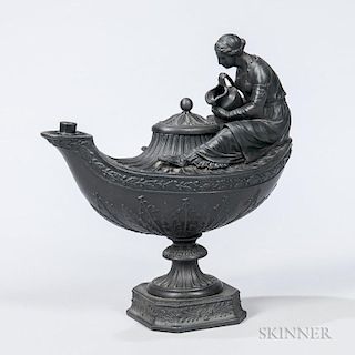 Wedgwood Black Basalt Vestal Lamp and Cover, England, 19th century, modeled with a female figure seated and pouring from a ju