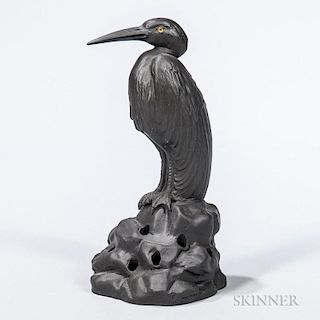 Wedgwood Black Basalt Egret on Rock, England, c. 1913, modeled by Ernest Light, with glass eyes and standing atop a pierced r