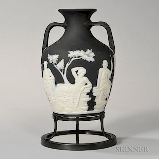 Wedgwood Thomas Lovatt Edition of the Portland Vase, England, c. 1880, solid black jasper with applied white classical figure