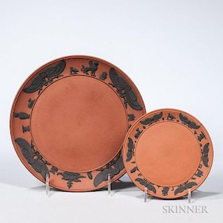 Two Wedgwood Rosso Antico Egyptian Plates, England, 19th century, each with applied black basalt hieroglyph border, impressed