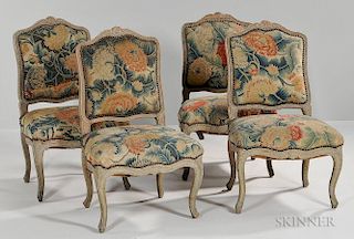 Four Louis XV Painted Side Chairs, each with a floral carved crest rail railed on cabriole legs with a floral-embroidered bac