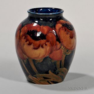Moorcroft Floral Decorated Vase, England, c. 1925, big poppy design in color to a washed blue ground, signed and impressed ma