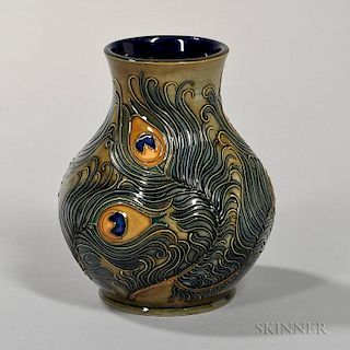 Moorcroft Peacock Feather Vase England, c. 1996, stylized feathers in color and set to a pale green ground, signed and impres