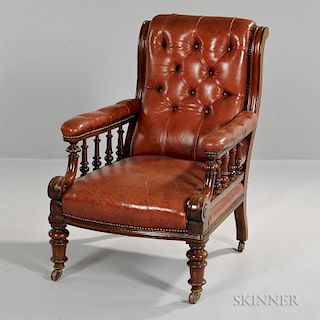 William IV Leather Armchair, England, 19th century, scroll crest over canted tufted back, padded scrolling tufted arms with t