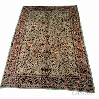Sarouk Carpet, Iran, c. 1930, with allover design of floral sprays on an unusual light green field, 10 ft. 3 in. x 7 ft. 2 in