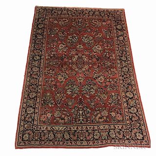 Sarouk Rug, Iran, c. 1940, featuring a classic Sarouk design of isolated floral sprays on a soft rose-red field, 8 ft. 3 in. 