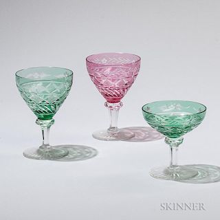 Thirty-two Pieces of Flash Cut to Clear Stemware, probably Bohemia, early 20th century, twenty pieces of green: twelve ht. 4 