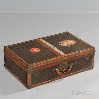Louis Vuitton Hard-sided Suitcase, France, early 20th century, brass-bound monogrammed canvas exterior with travel labels, in