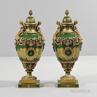 Pair of Sevres-style Porcelain Covered Urns, mid to late 19th century, each green with gilded highlights, domed top over balu
