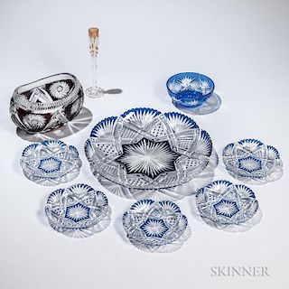 Nine Overlay Cut Glass Items, 20th century, seven blue and colorless: a large tray with star and fan motif, dia. 12 5/8, five