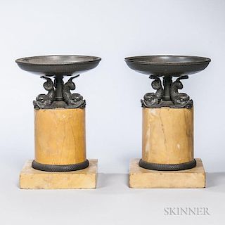 Pair of French Neoclassical-style Marble and Bronze Tazzas, 19th century, each shaped tray over dolphin supports on a hardsto