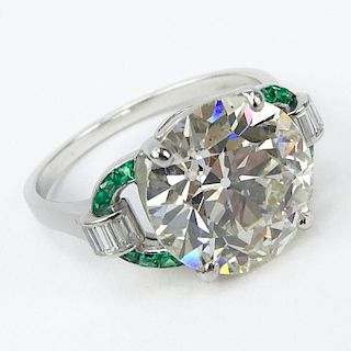 GIA Certified Art Deco 6.19 Carat Old European Cut Diamond and Platinum Engagement Ring with Emerald and Diamond Accents.