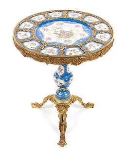 * A Sevres Style Porcelain Mounted Gilt Metal Gueridon 20TH CENTURY Height 29 1/4 x diameter 24 1/4 inches.