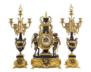 * A French Neoclassical Gilt Bronze and Marble Clock Garniture LATE 20TH CENTURY Height of clock 24 1/2 inches.