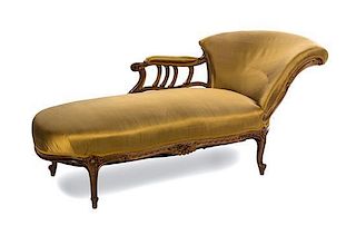 * A Louis XV Style Walnut Recamier EARLY 20TH CENTURY Width overall 70 inches.