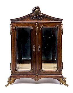 A French Gilt Metal Mounted Walnut Table Vitrine EARLY 20TH CENTURY Height 15 3/8 x width 10 3/8 x depth 7 3/4 inches.