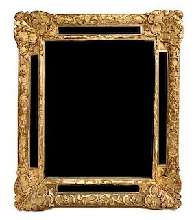 A Regence Giltwood Mirror 18TH CENTURY Height 28 x width 23 1/2 inches.