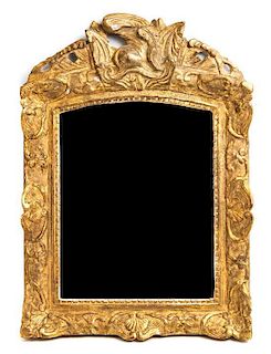 A Regence Giltwood Mirror 18TH CENTURY Height 25 1/4 x width 18 inches.