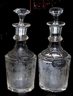 A pair of etched glass bourbon and scotch decanters late 19th century, both etched elk in the forest, silver plated identity 