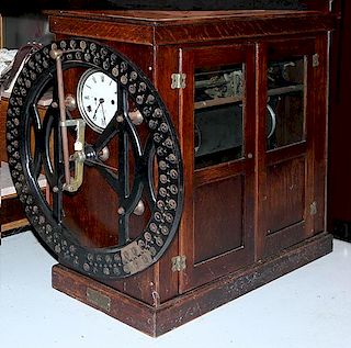 International time recording clock, fine condition with original wheel and dial 36" x 17" x 36"